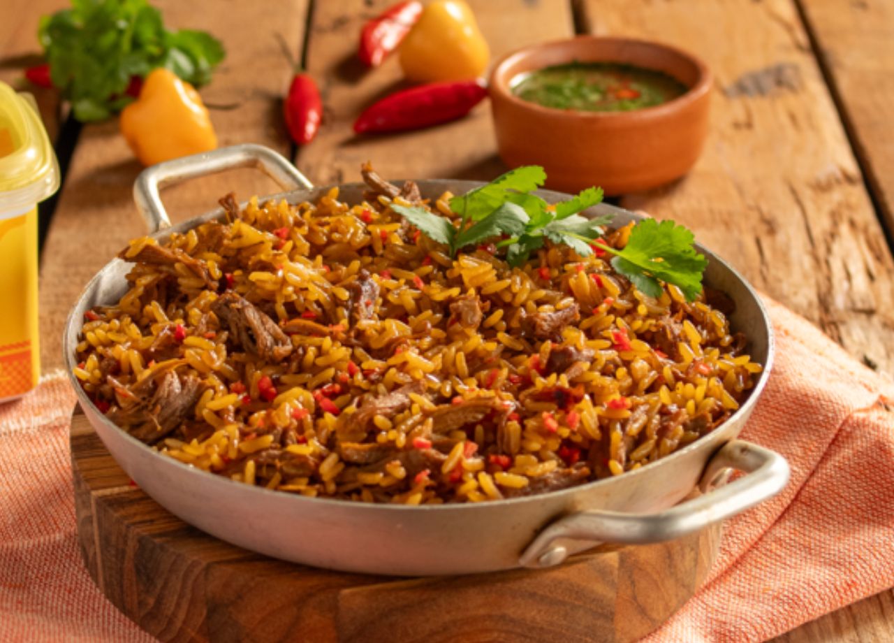 Arroz de pato com molho de pimenta de tucupi